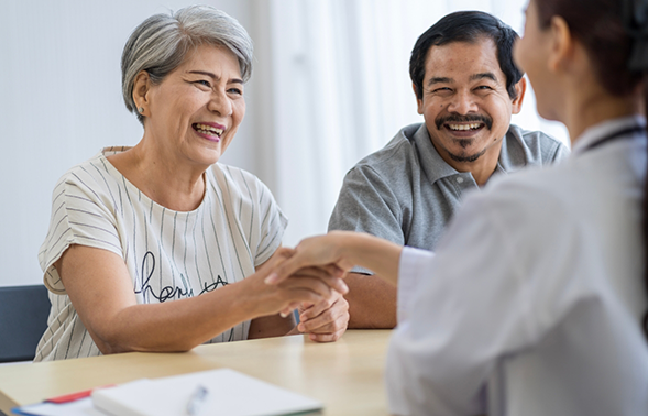 Senior man and woman at a consultation with a dentist