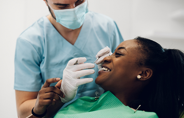 Dentist looking at a patient's teeth