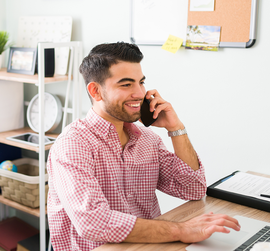 Man talking on the phone with a specialty dental office in Prosper