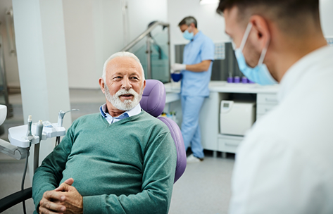 Senior man listening to his dentist