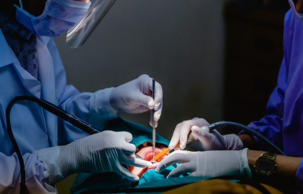 Oral surgery team treating a patient