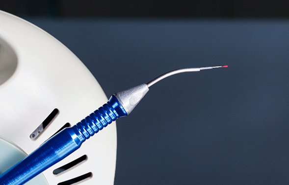 Close up of a pen-like dental laser device