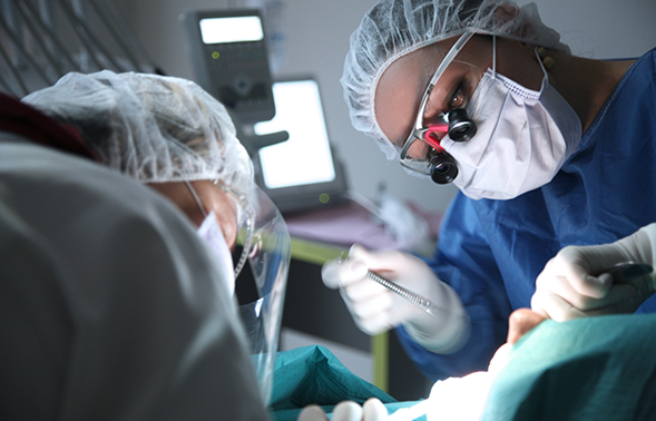 Oral surgery team treating a patient