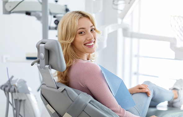 Blonde woman smiling in the treatment chair