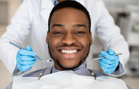 Man smiling in the dental treatment chair