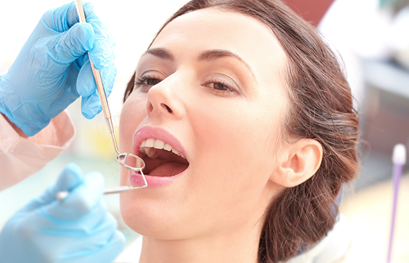 Woman receiving a dental exam