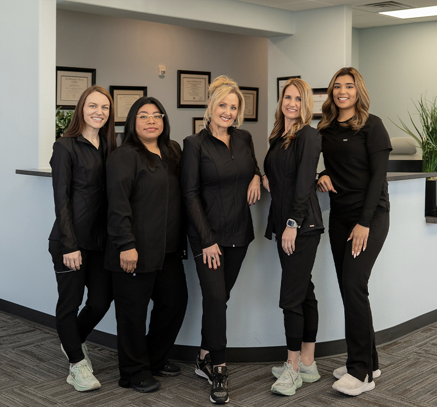 Dental team member talking with a patient
