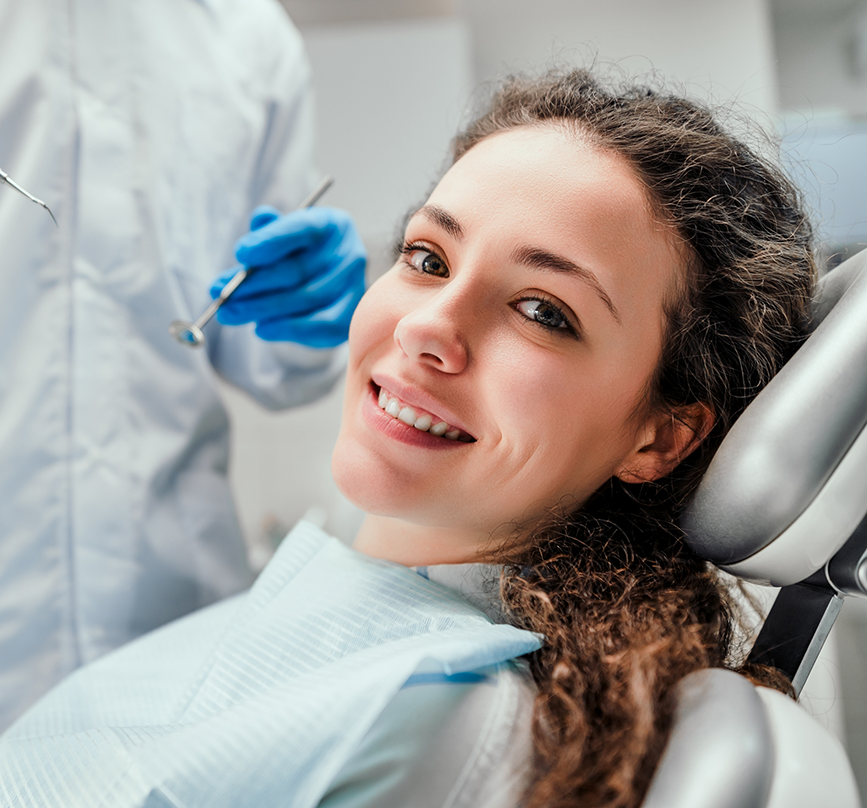 Woman smiling in the treatment chair before IV sedation dentistry in Prosper