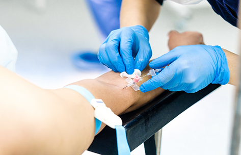 Patient having an IV placed in their arm