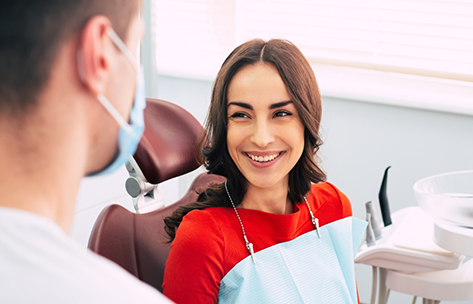 Woman smiling at her dentist